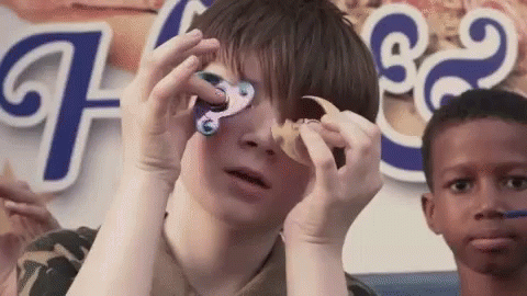 Boy Playing Fidget Spinner GIF