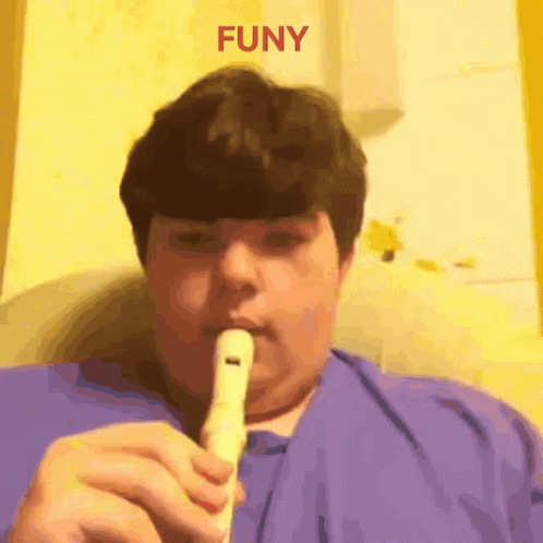 Boy Playing Flute Saying Funy