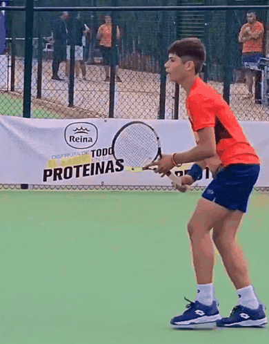 Boy Playing Tennis With Proteinas Banner