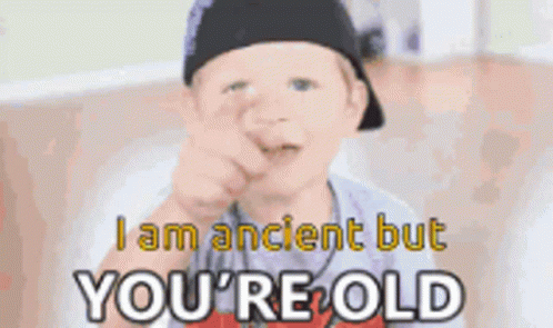 Boy Pointing at Camera Saying I Am Ancient But You're Old