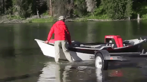 Boy Pulling Skiff Near Him GIF