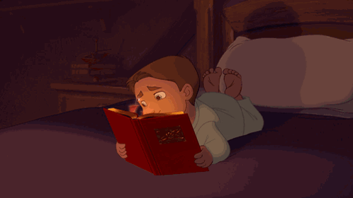 Boy Reading Bible on Bed