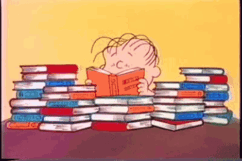 Boy Reading Book Surrounded by Books