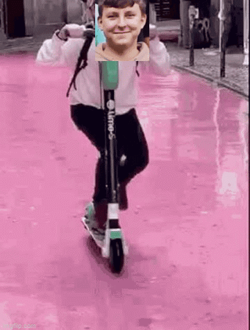 Boy Riding Scooter on Pink Street