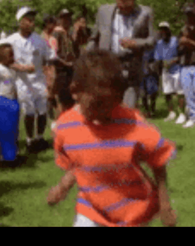 Boy Running In Orange And Blue Striped Shirt GIF