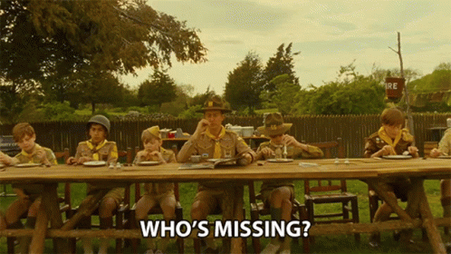Boy Scouts Sitting at Table Who's Missing