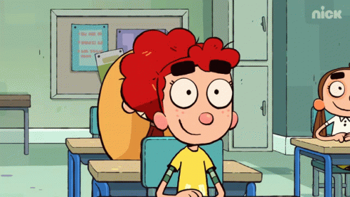 Boy Sitting at Desk With Nick Sign
