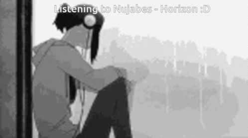 Boy Sitting in Front of Window Wearing Headphones