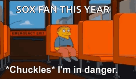 Boy Sitting on Bus with Sox Fan This Year