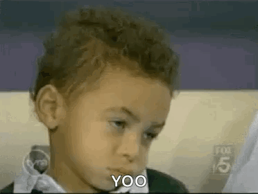 Boy Sitting on Couch Making Funny Face Saying Yoo