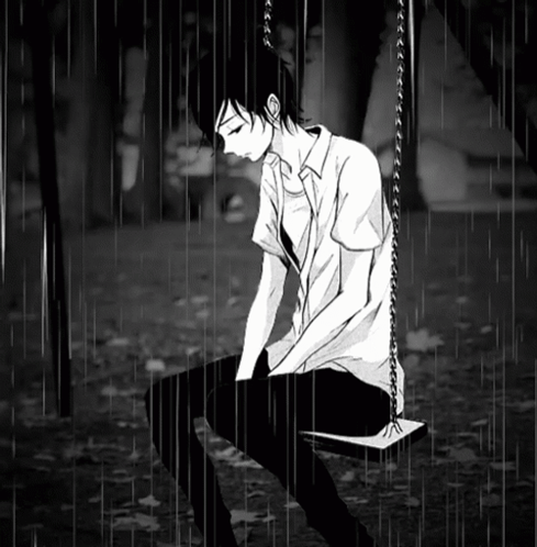 Boy Sitting On Swing In Rain GIF