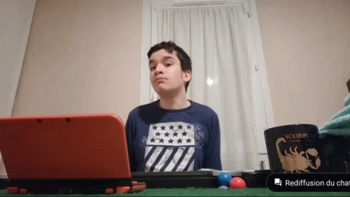 Boy Sitting With Red Nintendo 3DS And Scorpion Mug GIF