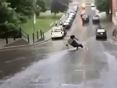 Boy Sliding On Wet Road GIF