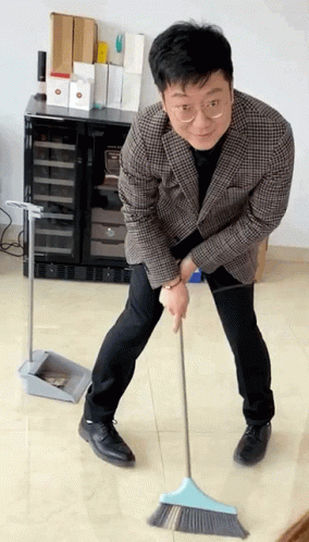 Boy Slowly Sweep His Floor GIF