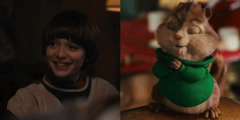 Boy Smiling Next To Chipmunk In Green Shirt GIF