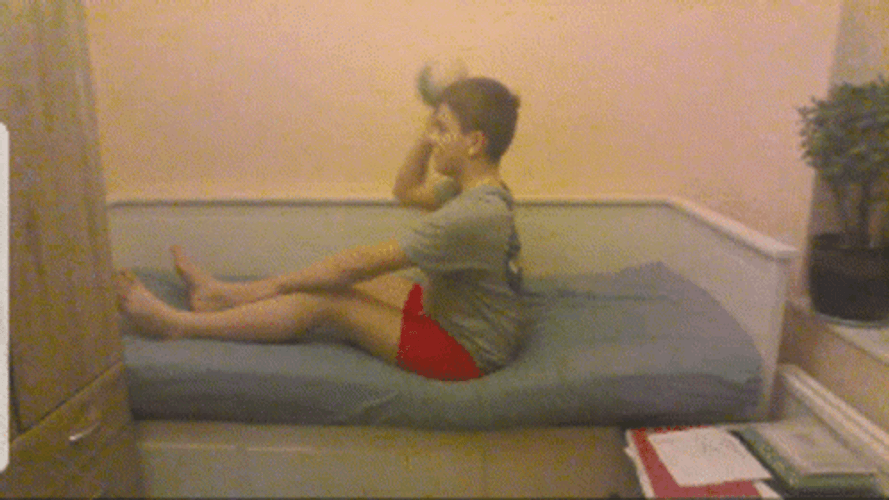 Boy Throwing Computer While Sitting GIF