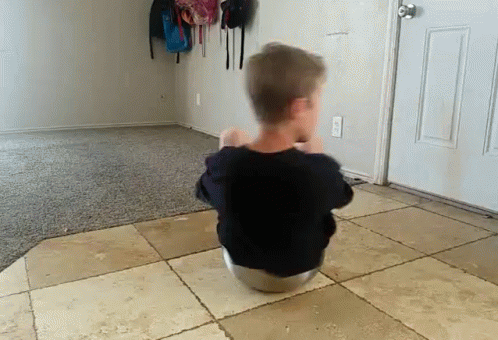 Boy Using Kitchen Bowl As Spinner GIF