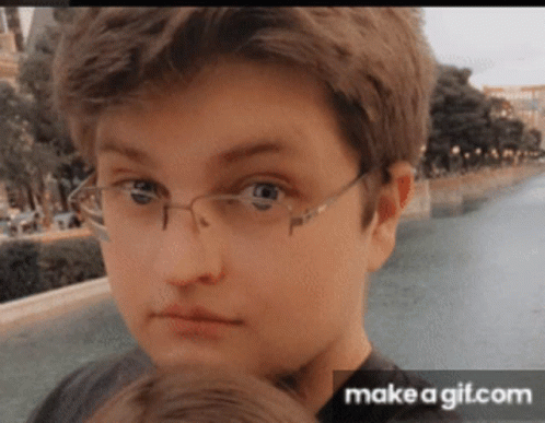 Boy Wearing Glasses Looking at Camera