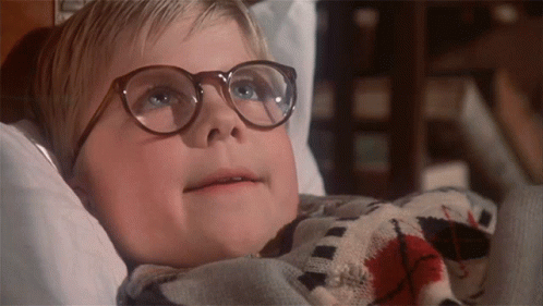 Boy Wearing Glasses Lying in Bed