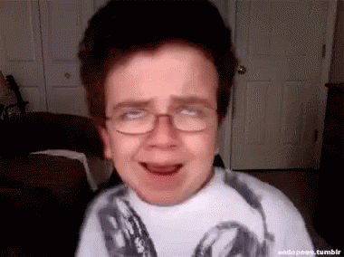 Boy Wearing Glasses Making Funny Face GIF