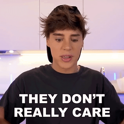 Boy Wearing Hat and Black Shirt Says They Don't Really Care