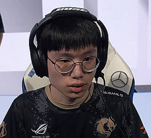 Boy Wearing Headphones And Republic Of Gamers Shirt GIF