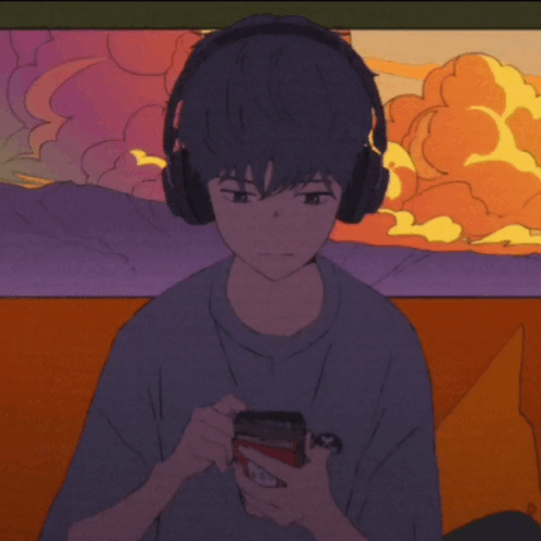 Boy Wearing Headphones Holding Cell Phone