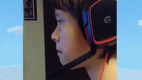 Boy Wearing Headphones with G
