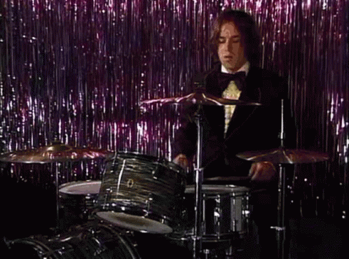 Boy Wearing Suit Playing Rim Shot GIF