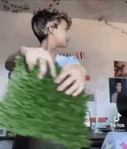 Boy With An Artificial Grass GIF