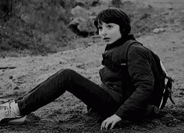 Boy with Backpack Sitting