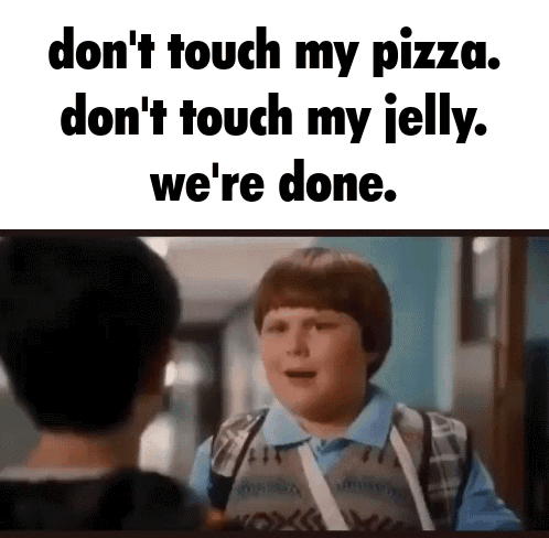 Boy With Bandage Talking to Another Boy Holding Pizza