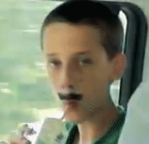 Boy With Cigarette Looking Out Window