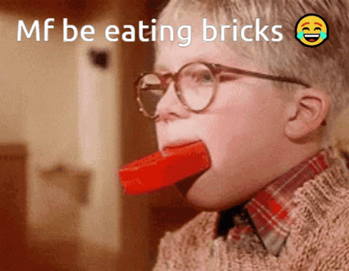 Boy with Glasses Eating Brick