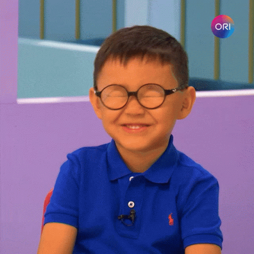 Boy with Glasses in Blue Polo Shirt and Ori