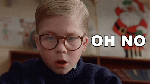 Boy With Glasses Says Oh No in Front of Santa Claus