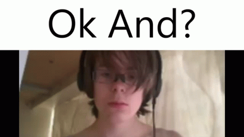 Boy With Headphones and Glasses Saying Ok