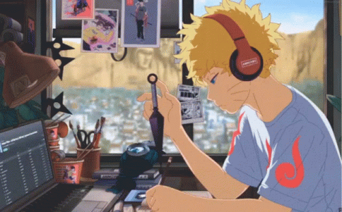 Boy with Headphones Sitting at Computer
