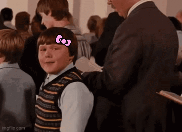 Boy with Hello Kitty Bow in Crowd