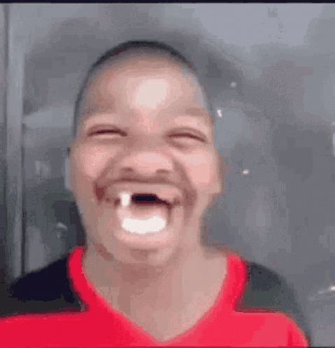 Boy With Missing Tooth Making Funny Face GIF