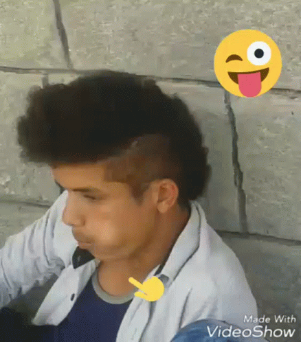 Boy With Mohawk and Smiley Face Behind