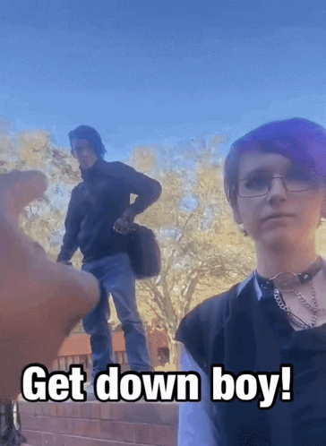 Boy With Purple Hair and Glasses Next to Man Saying Get Down Boy