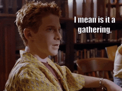 Boy With Red Hair Says I Mean Is It a Gathering in Front of Bookshelf