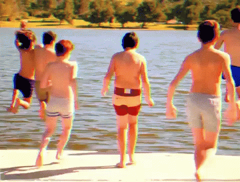 Boys Running Into Lake