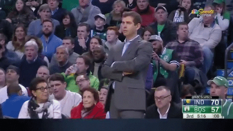 Brad Stevens Standing With Arms Tucked GIF