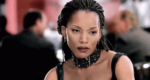 Braided Woman with Choker and Earrings Looking at Camera