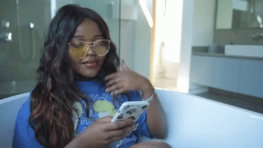 Brassy Lady Texting Hair Flip GIF