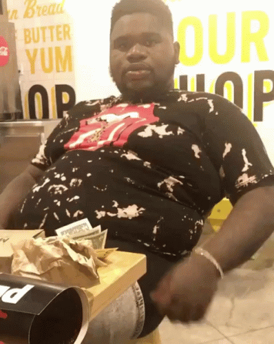 Bread Eating Black Man Falling Over GIF