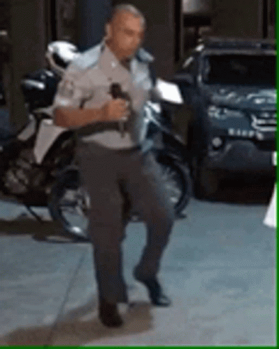 A Police Officer Breakdancing GIF