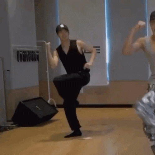 Man In Black Breakdancing GIF